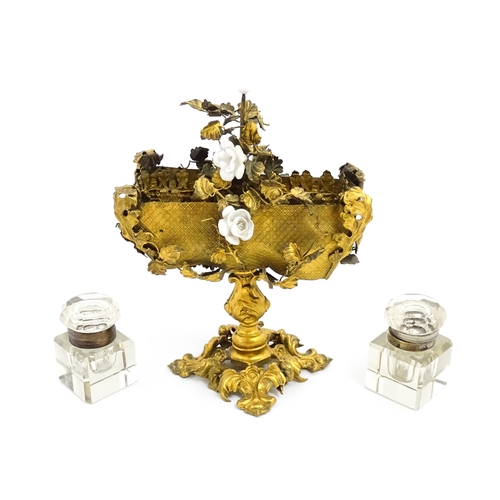 1426 - An unusual French 19thC gilt metal inkstand with scrolling foliate decoration and porcelain flowers,... 