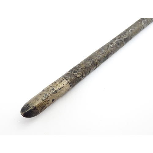 1430 - A Chinese white metal dipping pen with engraved floral decoration. Together with a small silver toot... 