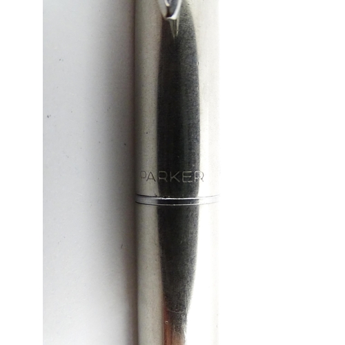 1431 - A silver cased ball point pen, hallmarked London 1976 maker Ramsden & Rowed, together with a Parker ... 