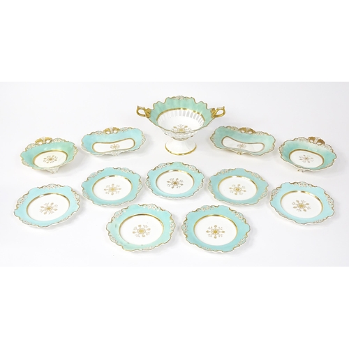 253 - A Davenport part dessert service decorated with a pale blue glaze and gilt floral detail, to include... 