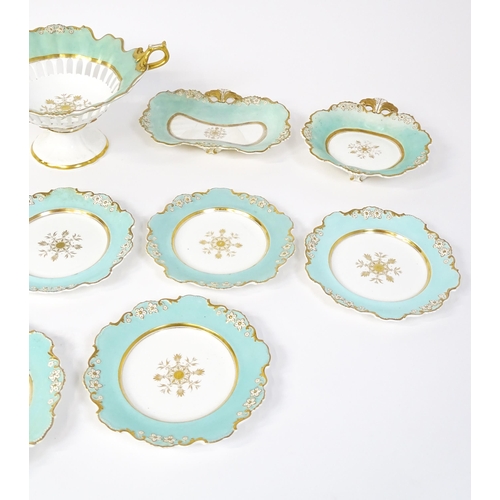 253 - A Davenport part dessert service decorated with a pale blue glaze and gilt floral detail, to include... 