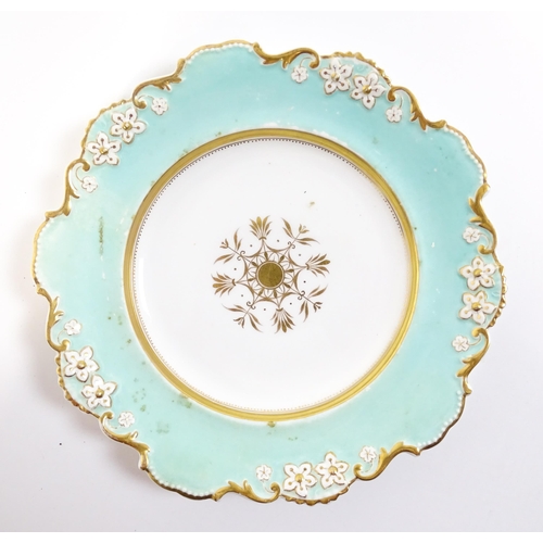 253 - A Davenport part dessert service decorated with a pale blue glaze and gilt floral detail, to include... 