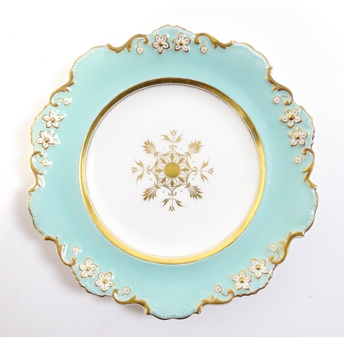 253 - A Davenport part dessert service decorated with a pale blue glaze and gilt floral detail, to include... 