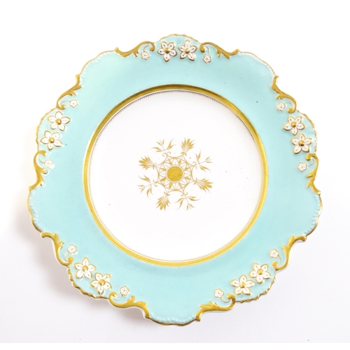 253 - A Davenport part dessert service decorated with a pale blue glaze and gilt floral detail, to include... 