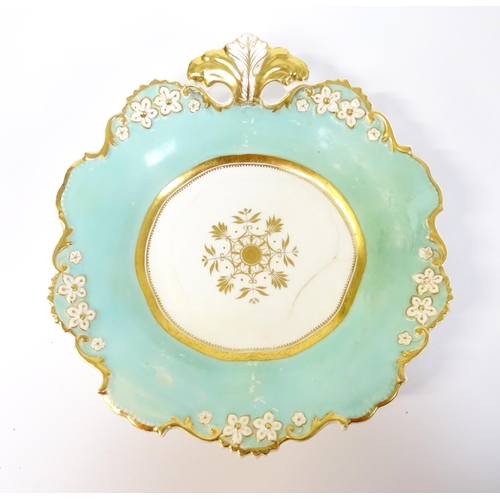 253 - A Davenport part dessert service decorated with a pale blue glaze and gilt floral detail, to include... 