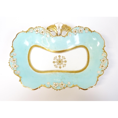 253 - A Davenport part dessert service decorated with a pale blue glaze and gilt floral detail, to include... 