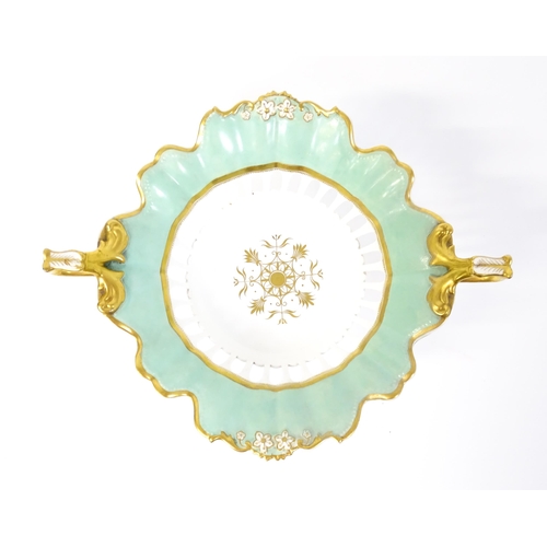 253 - A Davenport part dessert service decorated with a pale blue glaze and gilt floral detail, to include... 