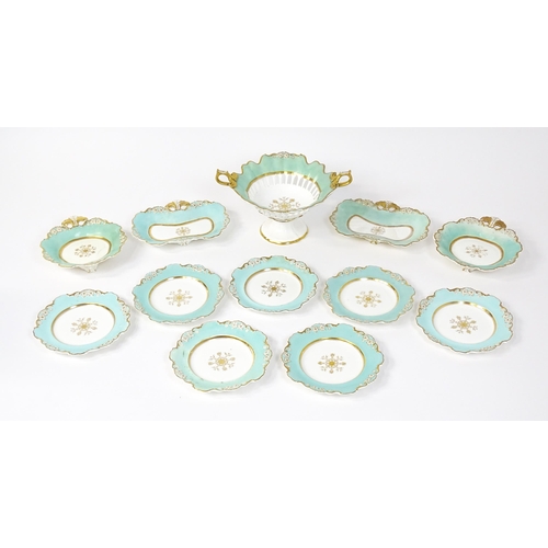 253 - A Davenport part dessert service decorated with a pale blue glaze and gilt floral detail, to include... 