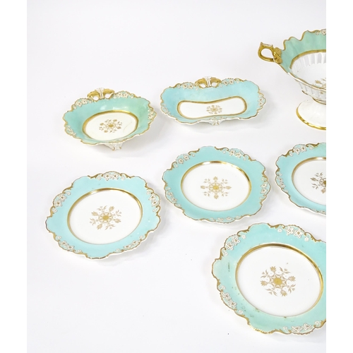 253 - A Davenport part dessert service decorated with a pale blue glaze and gilt floral detail, to include... 