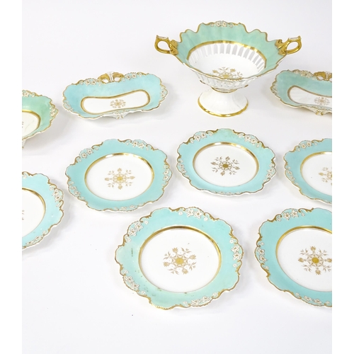 253 - A Davenport part dessert service decorated with a pale blue glaze and gilt floral detail, to include... 