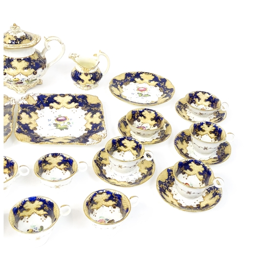 255 - A quantity of English 19thC tea wares with hand painted floral and foliate decoration and gilt highl... 