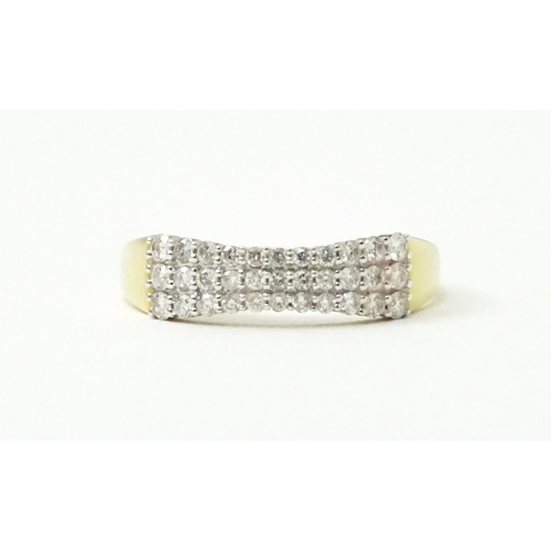 736 - A 9ct gold ring set with three bands of diamonds. Ring size approx. R 1/2