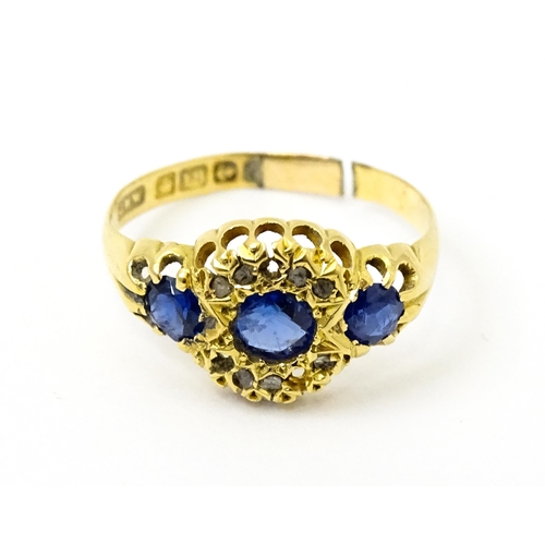 743 - A late 19thC 18ct gold ring set with sapphires and diamonds. Ring size approx.  N. (approx 2.2g)