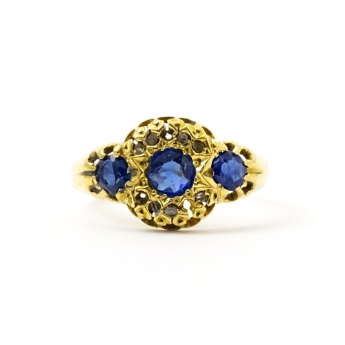 743 - A late 19thC 18ct gold ring set with sapphires and diamonds. Ring size approx.  N. (approx 2.2g)