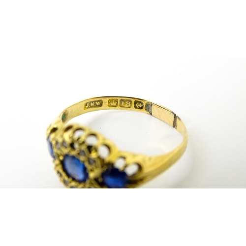 743 - A late 19thC 18ct gold ring set with sapphires and diamonds. Ring size approx.  N. (approx 2.2g)