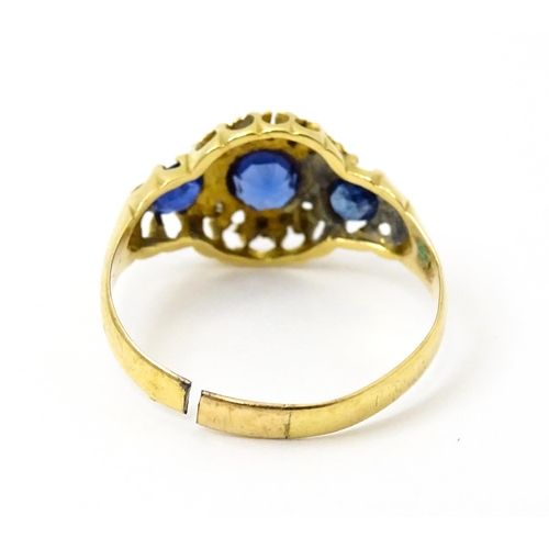 743 - A late 19thC 18ct gold ring set with sapphires and diamonds. Ring size approx.  N. (approx 2.2g)