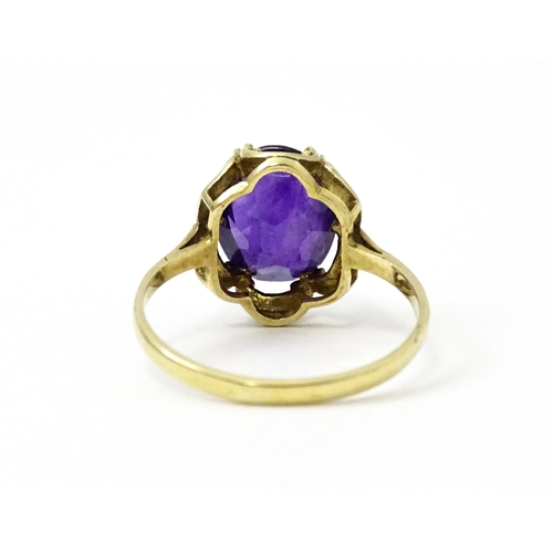 745 - A 9ct gold dress ring set with amethyst. Ring size approx. M 1/2