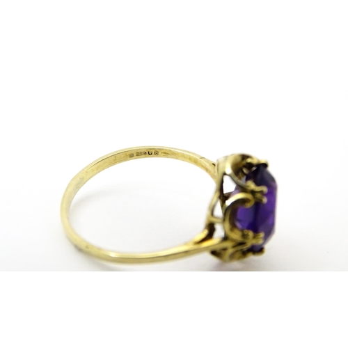 745 - A 9ct gold dress ring set with amethyst. Ring size approx. M 1/2