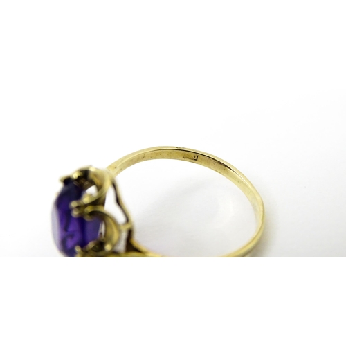 745 - A 9ct gold dress ring set with amethyst. Ring size approx. M 1/2