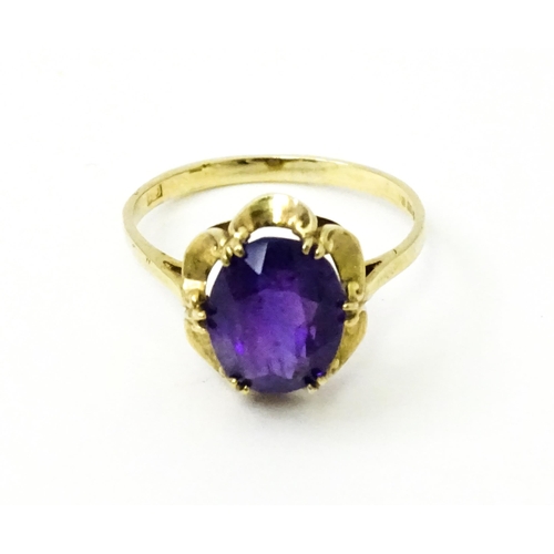 745 - A 9ct gold dress ring set with amethyst. Ring size approx. M 1/2