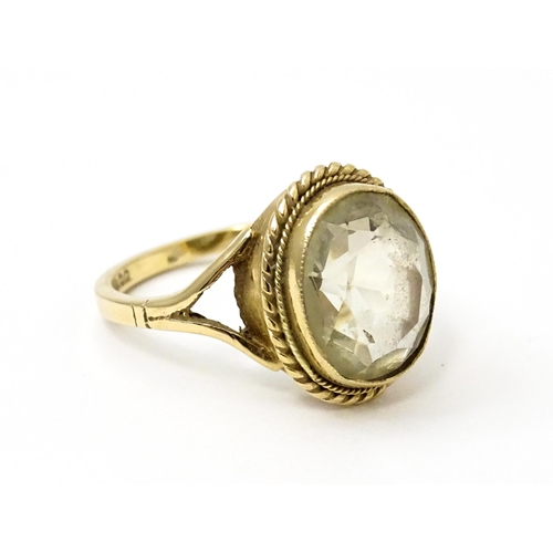 752 - A 9ct gold ring set with central citrine. Ring size approx. M