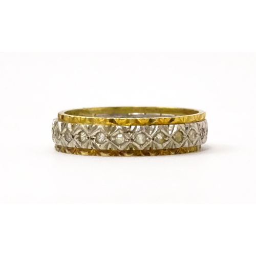 759 - A gold and  white metal ring set with white stones. Ring size approx. O