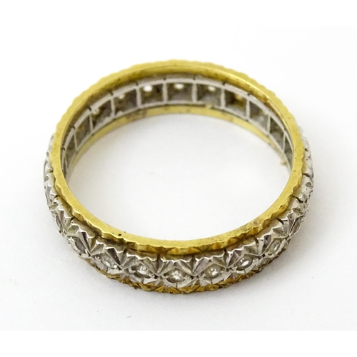 759 - A gold and  white metal ring set with white stones. Ring size approx. O