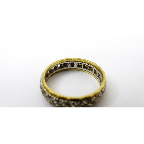 759 - A gold and  white metal ring set with white stones. Ring size approx. O