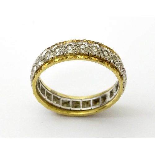 759 - A gold and  white metal ring set with white stones. Ring size approx. O