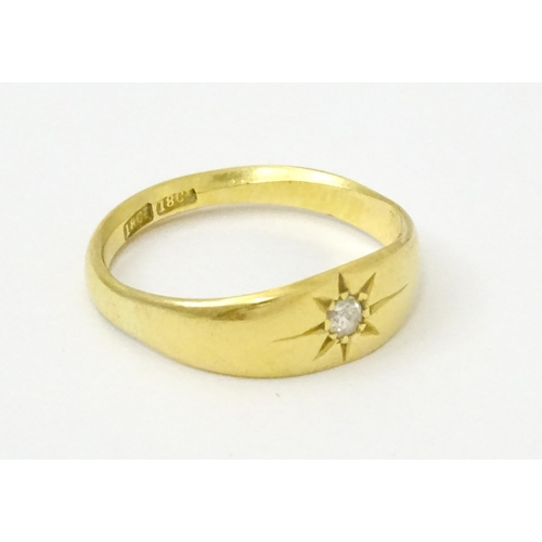 761 - An 18ct gold ring set with central diamond. Ring size approx. L 1/2  (Approx. TW 3.6g)