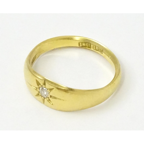 761 - An 18ct gold ring set with central diamond. Ring size approx. L 1/2  (Approx. TW 3.6g)