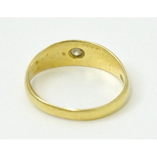 761 - An 18ct gold ring set with central diamond. Ring size approx. L 1/2  (Approx. TW 3.6g)