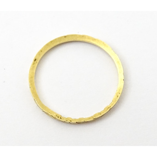 764 - A Victorian 18ct gold ring with engraved decoration. Hallmarked London 1853. Ring size approx.  J (A... 