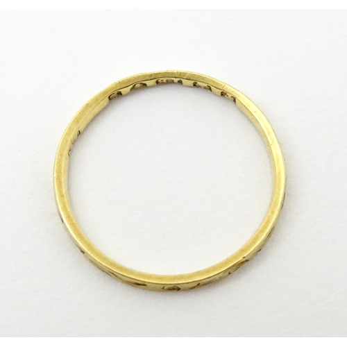 764 - A Victorian 18ct gold ring with engraved decoration. Hallmarked London 1853. Ring size approx.  J (A... 