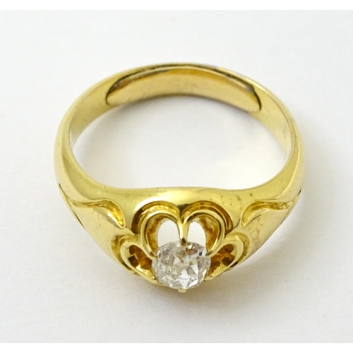 771 - A late 19thC / early 20thC gold ring set with central diamond. Diamond approx 1/8