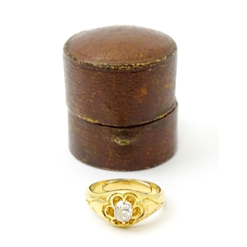 771 - A late 19thC / early 20thC gold ring set with central diamond. Diamond approx 1/8