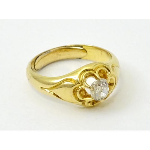 771 - A late 19thC / early 20thC gold ring set with central diamond. Diamond approx 1/8