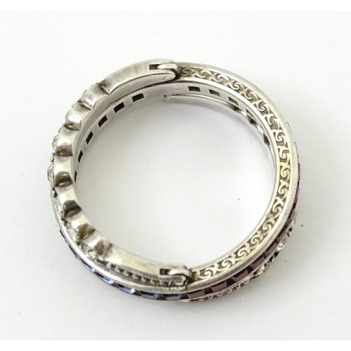 773 - An unusual metamorphic Art Deco eternity ring the central band half set with red stones and half set... 