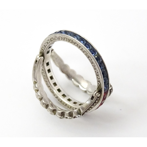 773 - An unusual metamorphic Art Deco eternity ring the central band half set with red stones and half set... 