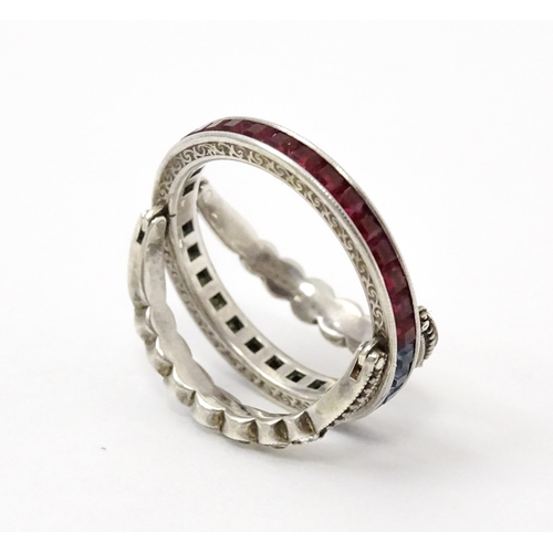 773 - An unusual metamorphic Art Deco eternity ring the central band half set with red stones and half set... 