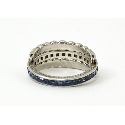 773 - An unusual metamorphic Art Deco eternity ring the central band half set with red stones and half set... 