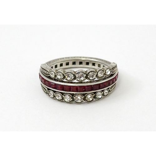 773 - An unusual metamorphic Art Deco eternity ring the central band half set with red stones and half set... 