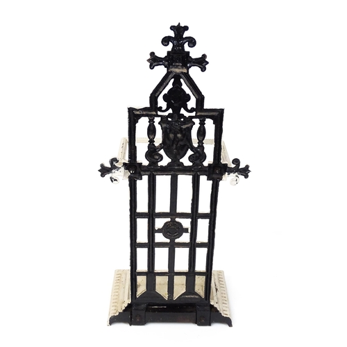 1475 - An Aesthetic Movement cast iron stick stand, decorated with goat's mask, rose and beading, in grey p... 