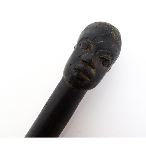 1478 - Ethnographic / Native / Tribal : An African hardwood stick / cane with carved twist detail, the pomm... 