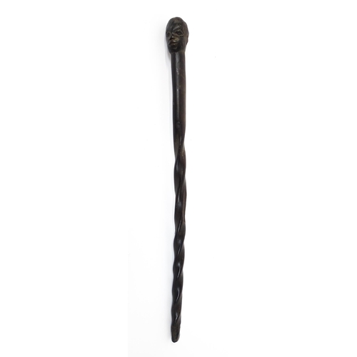 1478 - Ethnographic / Native / Tribal : An African hardwood stick / cane with carved twist detail, the pomm... 