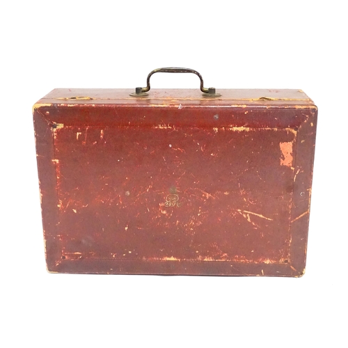 1496 - An early 20thC British government despatch box, the red leather exterior with gold tooled George V c... 