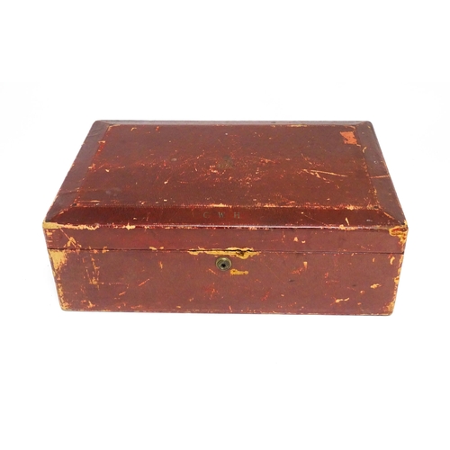 1496 - An early 20thC British government despatch box, the red leather exterior with gold tooled George V c... 