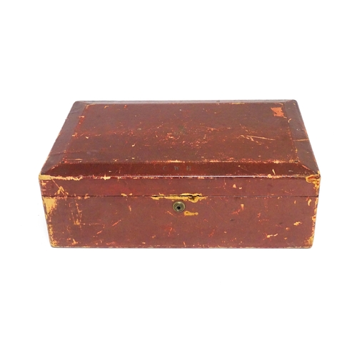 1496 - An early 20thC British government despatch box, the red leather exterior with gold tooled George V c... 