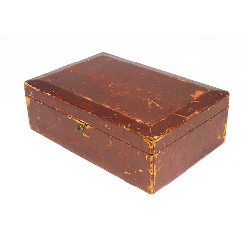 1496 - An early 20thC British government despatch box, the red leather exterior with gold tooled George V c... 