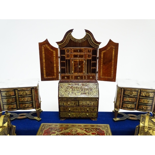 1497 - A showcase containing a display of early 21stC scale model miniature models of furniture to include ... 